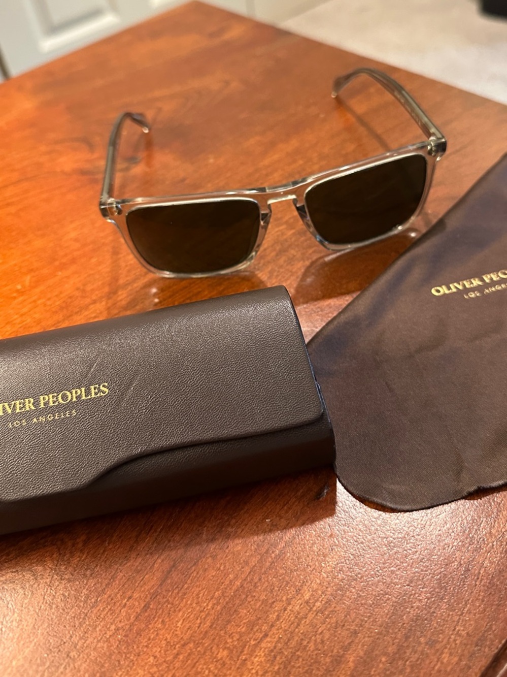Oliver Peoples Clear Frame Sunglasses with Brown Lenses